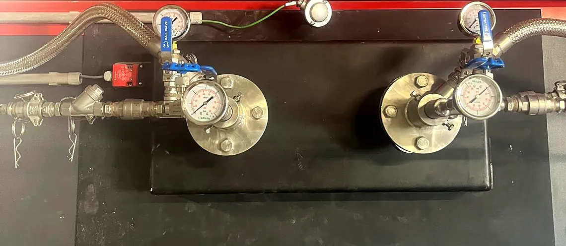 Two SNCR urea injection lances installed on the 2.5 MW biomass boiler, with pressure gauges and atomising lines – France